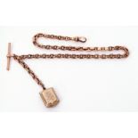 9ct stamped watch chain, plain polished oval link design suspending a 9ct bar and a gilt metal