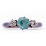 Blue zircon and diamond ring, a centre stone set between two small single cut diamonds, stamped