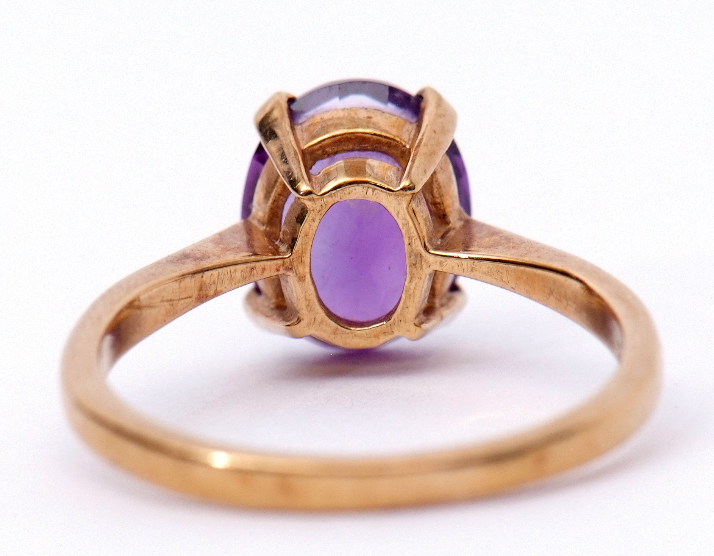 Amethyst dress ring, the oval faceted cut amethyst, 9 x 6mm, four claw set and raised between - Image 3 of 5
