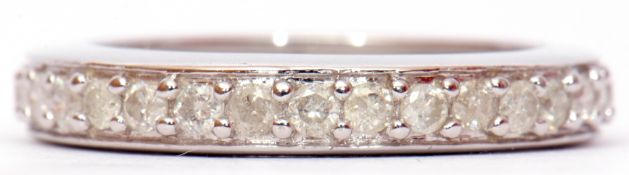 Modern precious metal small diamond full eternity ring, size N/O, gross weight 2.2gms, stamped 375