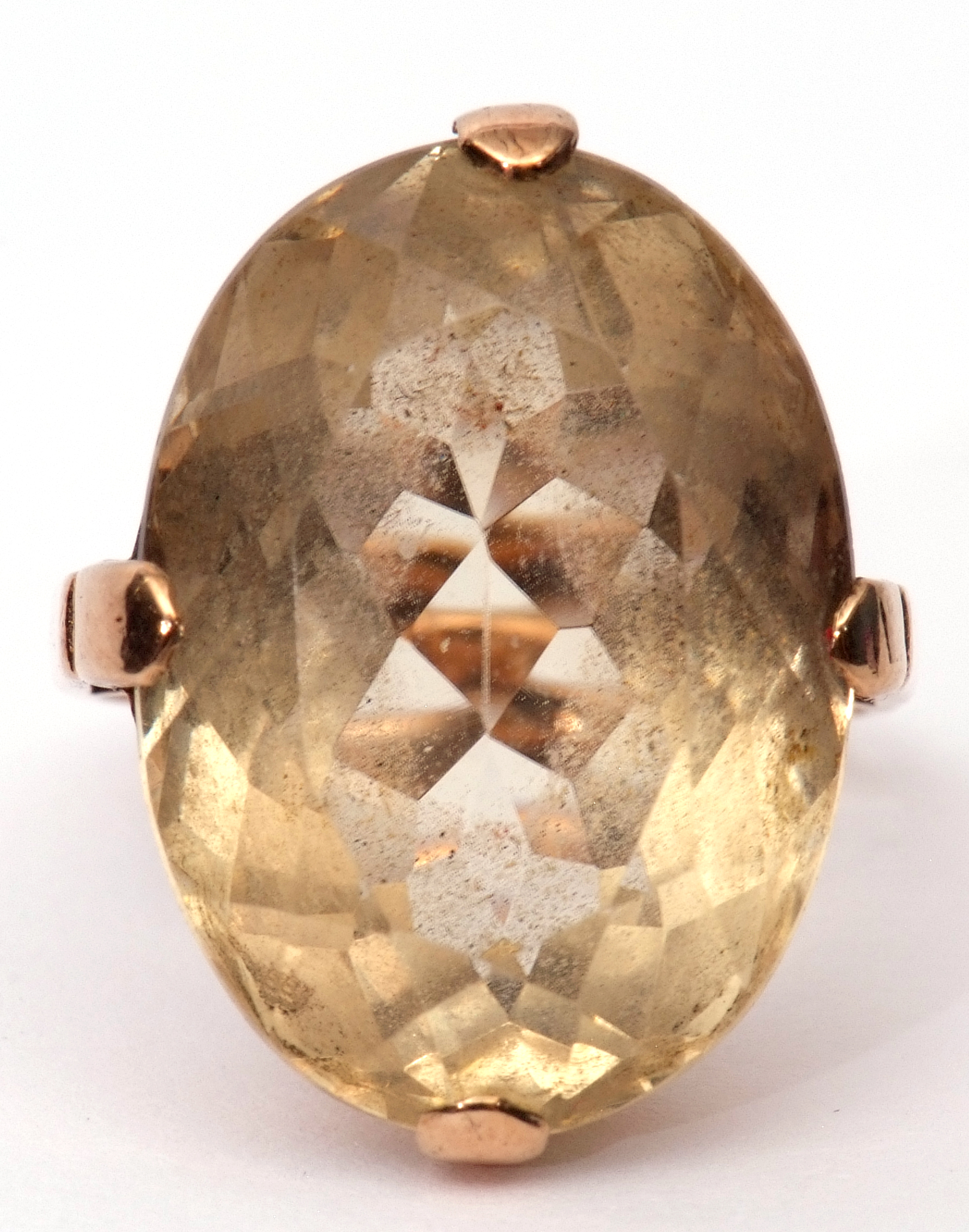 Large Citrine quartz dress ring of oval faceted shape, cardinal set in a plain polished basket