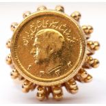 Iran gold half Pahlavi coin ring, the coin set in an ornate pierced bead basket mount to a split