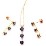 Modern 10K stamped blue stone pendant and matching earrings, each individually set and raised on