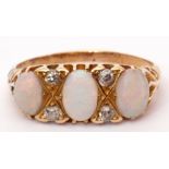 Antique opal and diamond ring, the three oval shaped cabochon opals highlighted with small old cut