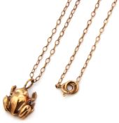 Hallmarked 9ct gold frog pendant suspended from a 9K stamped chain, gross weight 3.2gms