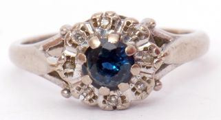 18ct white gold sapphire and diamond cluster ring, the central circular shaped sapphire raised