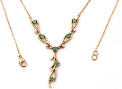 9ct gold emerald and diamond set necklace, the three articulated branches set with 7 small