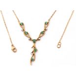 9ct gold emerald and diamond set necklace, the three articulated branches set with 7 small