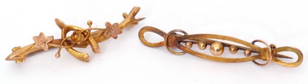 Mixed Lot: 9ct gold brooch, a design of a central wishbone on a foliate branch, together with a