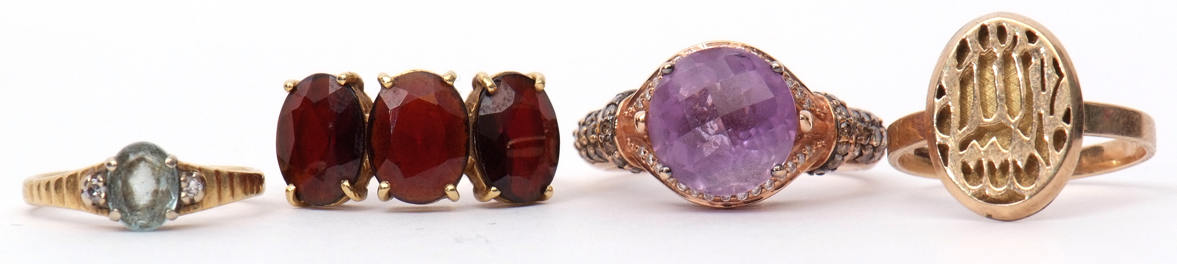 Mixed Lot: modern amethyst and diamond dress ring, stamped 14K, a modern 750 stamped three stone