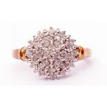 Modern diamond and cluster ring, a circular shaped panel set with small single cut diamonds, total