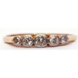 Five stone diamond ring, featuring 5 small graduated old cut diamonds, each individually bezel