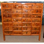 20th century Chinese medicine cabinet, 28 drawers decorated with Chinese inscriptions, 132cm wide
