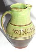 Winchcombe Pottery jug with green slip decoration dated Winchcombe 1950 by Ray Finch, impressed