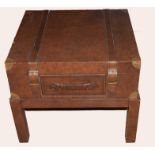 Modern designer side table with drawer modelled as a leather trunk on stand, 66cm wide