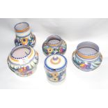 Group of four Poole Pottery Studio vases, all with floral designs by Truda Carter, largest 17cm high