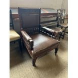 LARGE 19TH CENTURY UPHOLSTERED LEATHER HALL CHAIR WITH CARVED DECORATION TO BACK AND SPINDLE