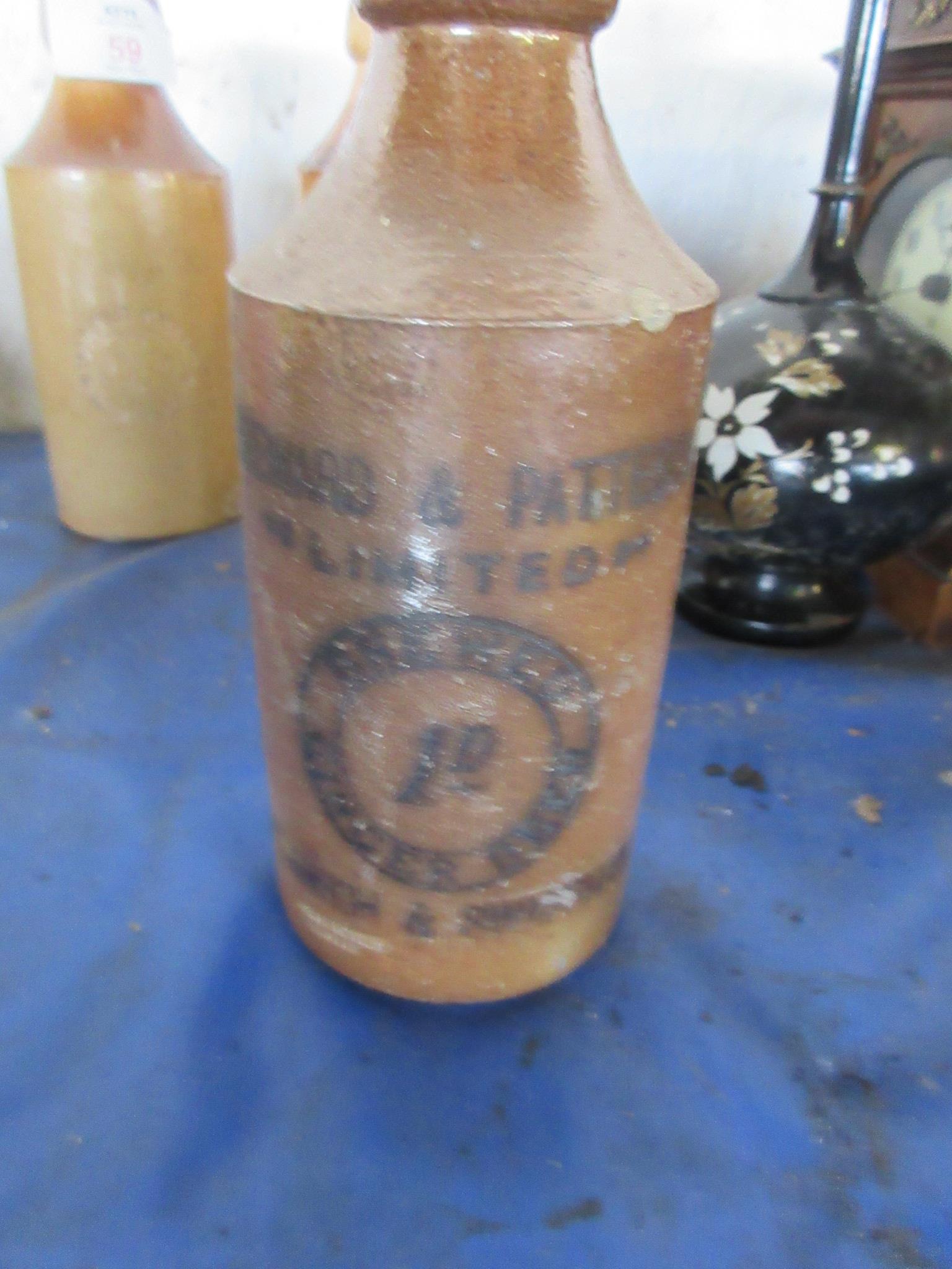 THREE SALT GLAZED STONEWARE BOTTLES INCLUDING STEWARD & PATTESON, NORWICH AND SWAFFHAM AND TWO - Image 2 of 4