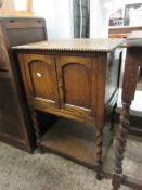 MID-20TH CENTURY OAK FRAMED SIDE CUPBOARD WITH TWO CUPBOARD DOORS OVER OPEN SHELF WITH BARLEY