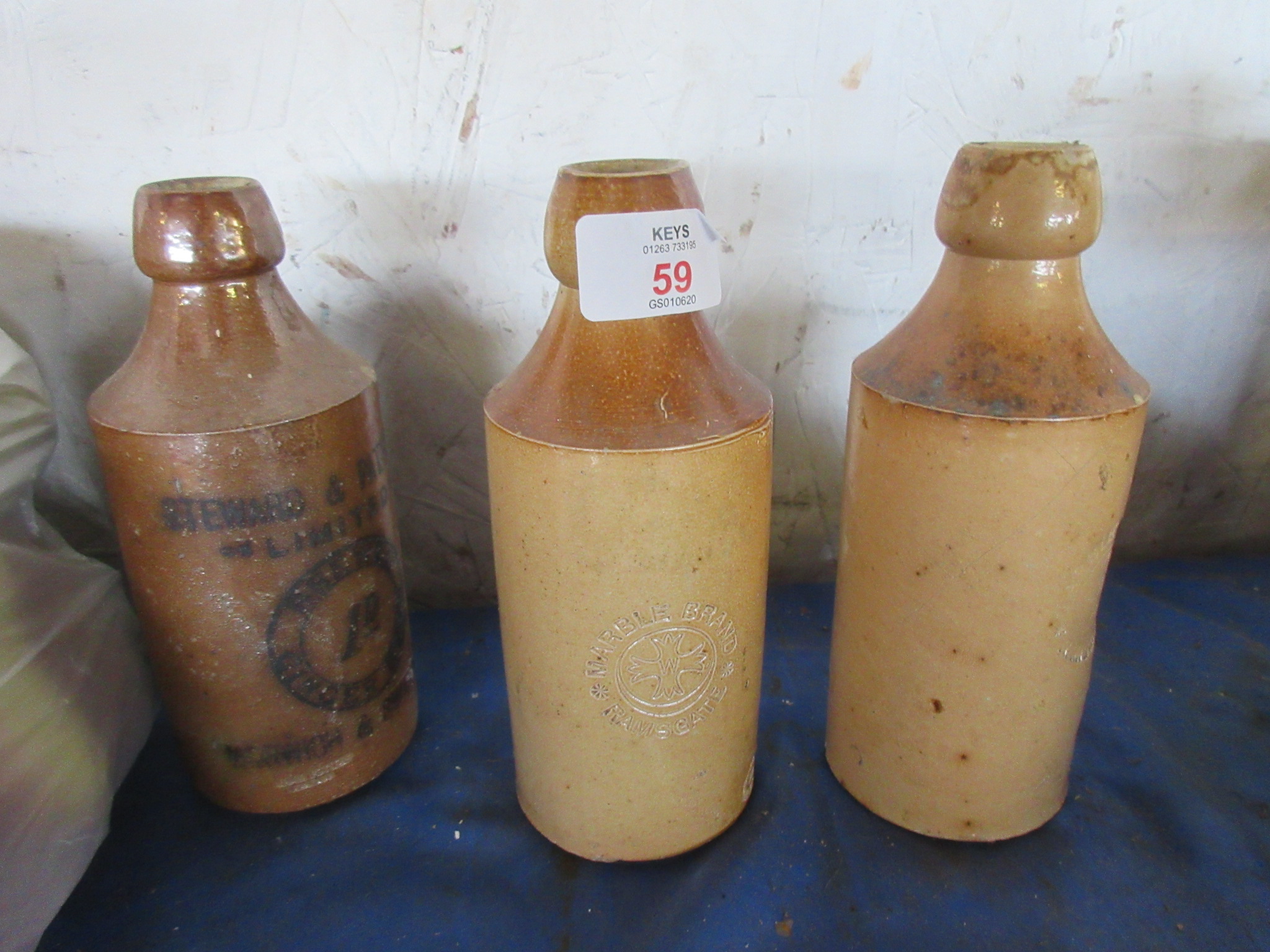 THREE SALT GLAZED STONEWARE BOTTLES INCLUDING STEWARD & PATTESON, NORWICH AND SWAFFHAM AND TWO