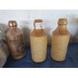 THREE SALT GLAZED STONEWARE BOTTLES INCLUDING STEWARD & PATTESON, NORWICH AND SWAFFHAM AND TWO