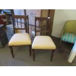 PAIR OF EDWARDIAN MAHOGANY FRAMED SPINDLE BACK DINING CHAIRS WITH TURNED FRONT LEGS WITH CREAM