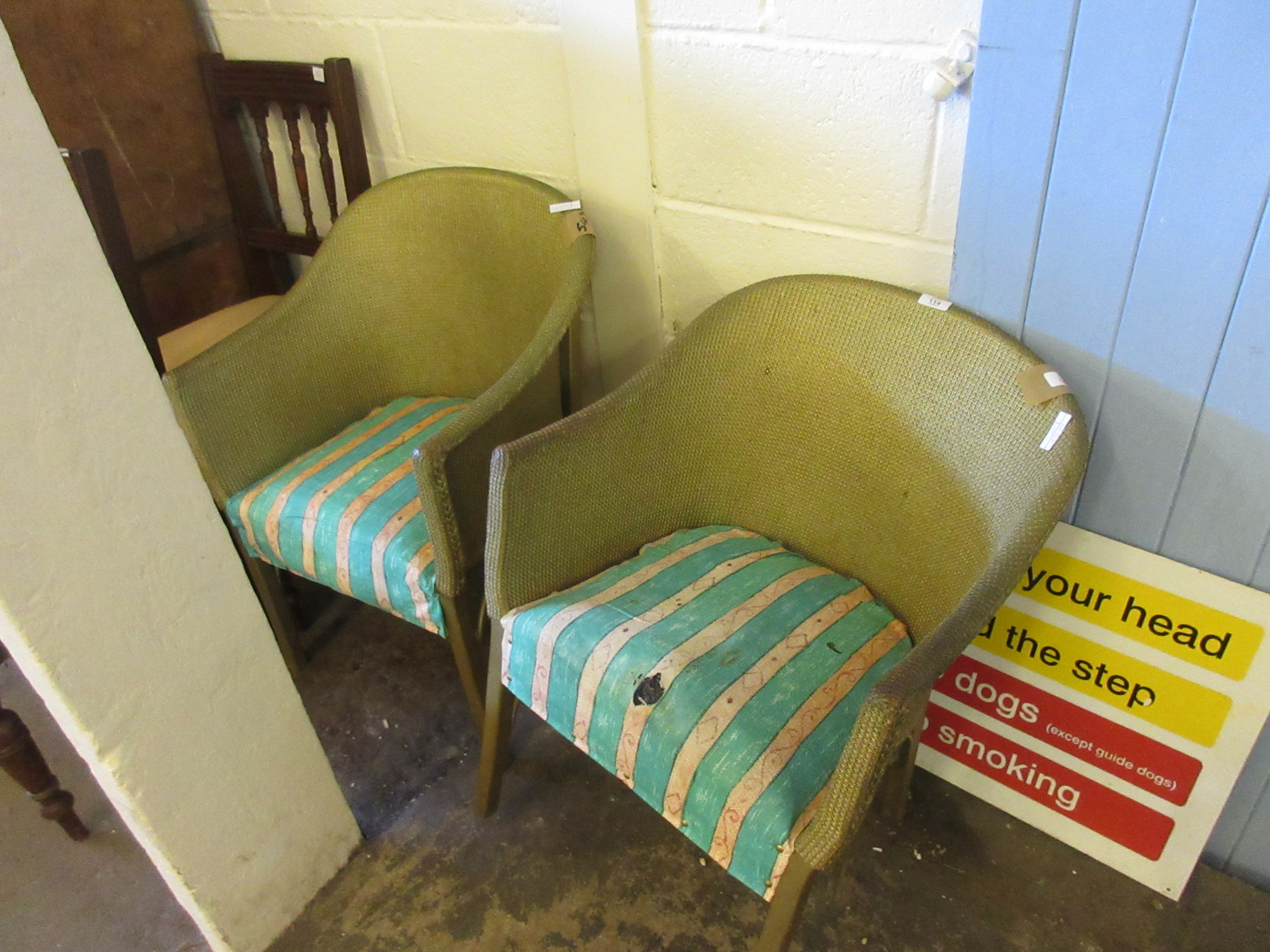 TWO WICKER LLOYD LOOM TYPE CHAIRS WITH STRIPED UPHOLSTERED SEATS