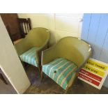 TWO WICKER LLOYD LOOM TYPE CHAIRS WITH STRIPED UPHOLSTERED SEATS