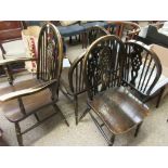 SET OF FIVE HARD SEATED STICK BACK WHEEL BACK CHAIRS COMPRISING FOUR DINING CHAIRS AND A CARVER