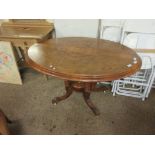 19TH CENTURY WALNUT OVAL CIRCULAR TILT TOP TABLE WITH INLAID DETAIL ON A QUATREFOIL BASE RAISED ON