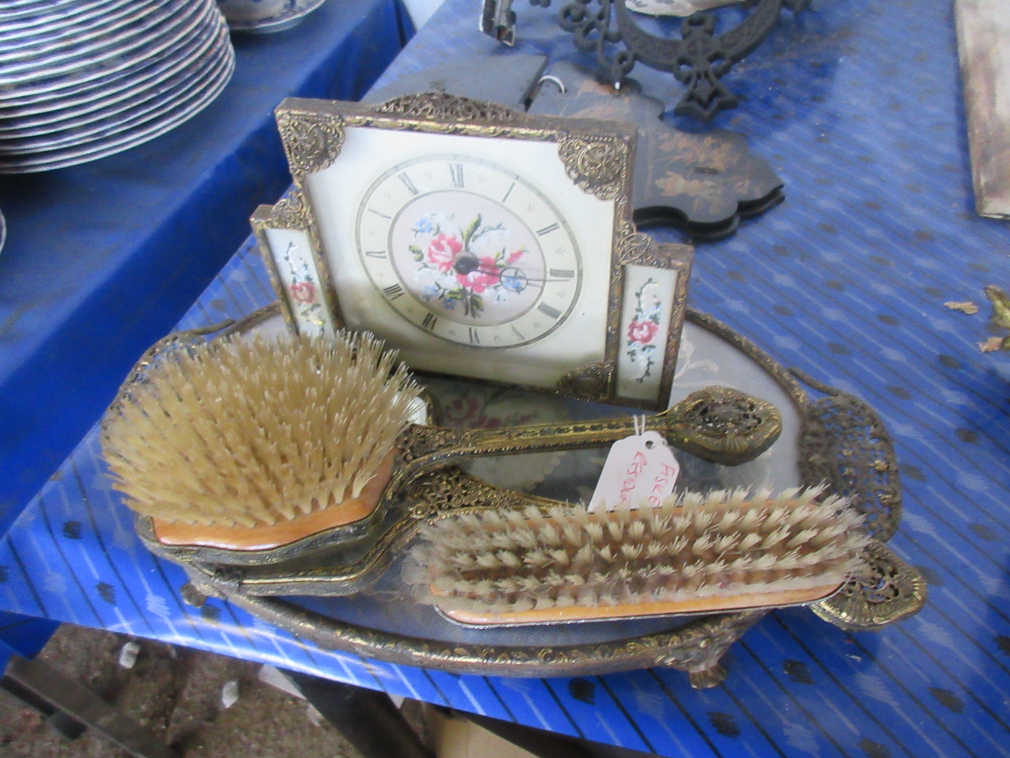 ORNATE GILT PIERCED WORK DRESSING TABLE SET COMPLETE WITH CLOCK, AND A LATER CLOTHES BRUSH