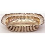 Late 19th century white metal shallow table dish of rectangular form, with scroll rim and ribbed