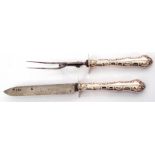 Pair of Edward VII steel bladed carvers with decorative scroll embossed silver encased handle, the