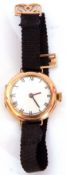 Ladies first quarter of 20th century hallmarked 9ct gold cased wrist watch with black hands, black