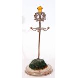 George V hat pin cushion stand, the central stand in the form of a Scottish hat pin with a thistle