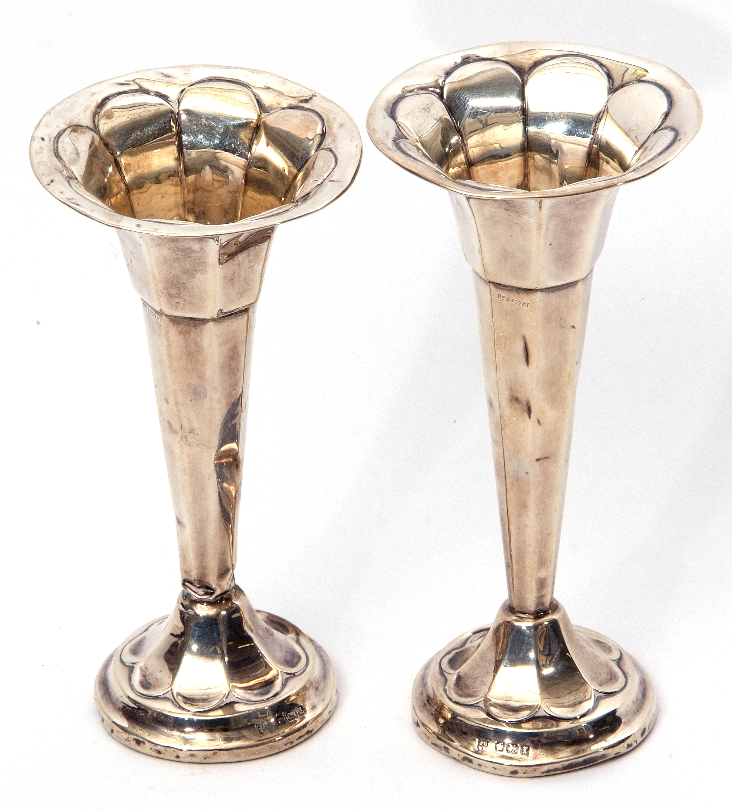 Pair of George V small trumpet flower vases of panelled circular form with tapering stems and loaded