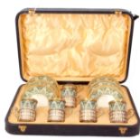 George V cased decorative Wedgwood bone china and silver coffee set comprising six saucers, five