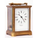 Last quarter of 19th century brass and glass cased carriage timepiece, the white enamelled face with