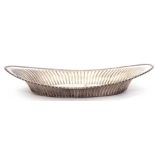 White metal bread roll dish of shaped oval form, fluted body with beaded rim, stamped "Sterlnig",