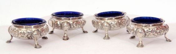 Victorian set of four cauldron salts each with flared rims, chased and embossed with floral
