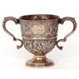 Victorian silver loving cup, profusely decorated with dogs, birds and a foliate design, having two