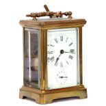 Last quarter of 19th/first quarter of 20th century brass and glass cased carriage clock of plain