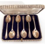 George V cased matching six silver golf tea spoons with embossed crossed golf clubs and ball at