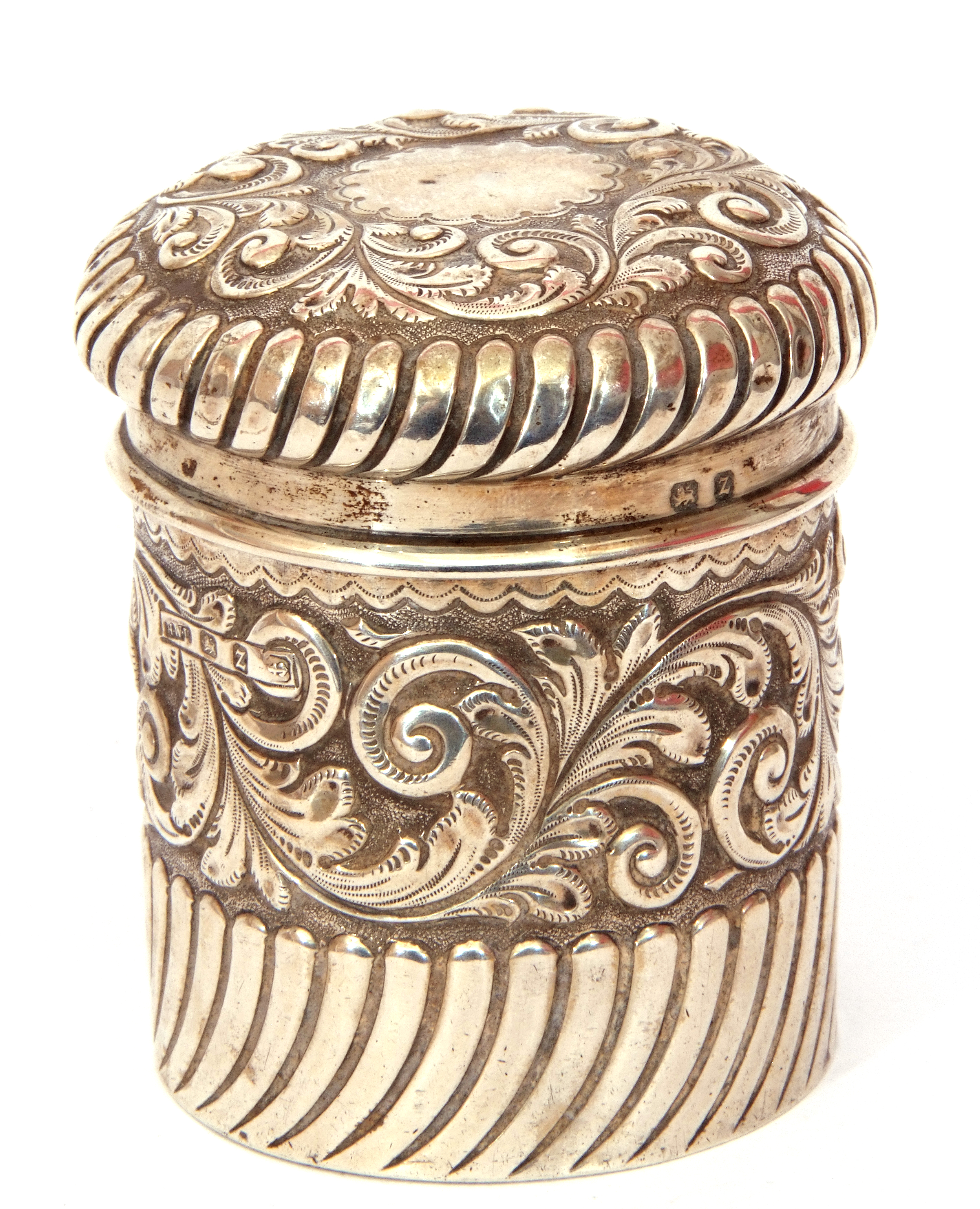 Late Victorian silver lidded canister of cylindrical form, embossed and wrythen decoration,