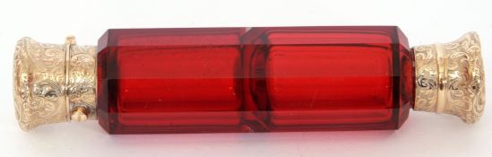 19th century ruby glass scent bottle of faceted form with gilt metal mounts and stopper, 12cm long