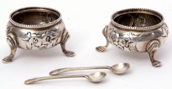 Small pair of Victorian cauldron salts, floral and foliate embossed supported on three curved