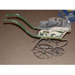 Vintage dog cart containing the remnants of original cane and fabric upholstery over a wrought
