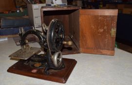 19th century Wilcox & Gibbs sewing machine with original wooden box