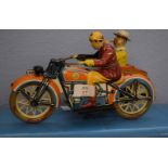Mid-20th century tin plate model of a motor cyclist and side car both with figures