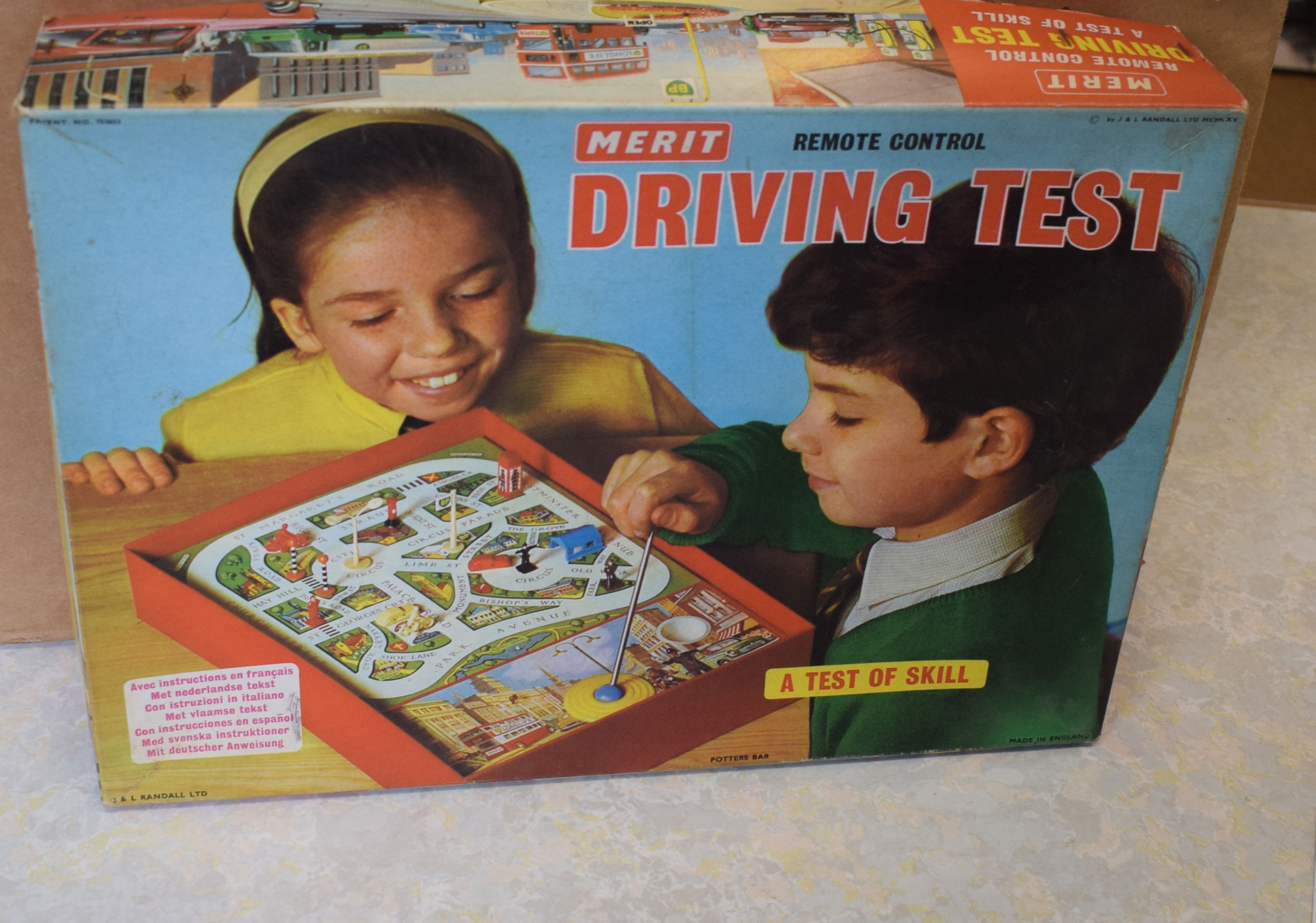 Merit driving test game, boxed, with Brimtoy train set, Tri-ang Busy Baby toy and other toys (boxed)